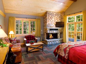 Interior of deluxe bedroom suite at alpine village jasper