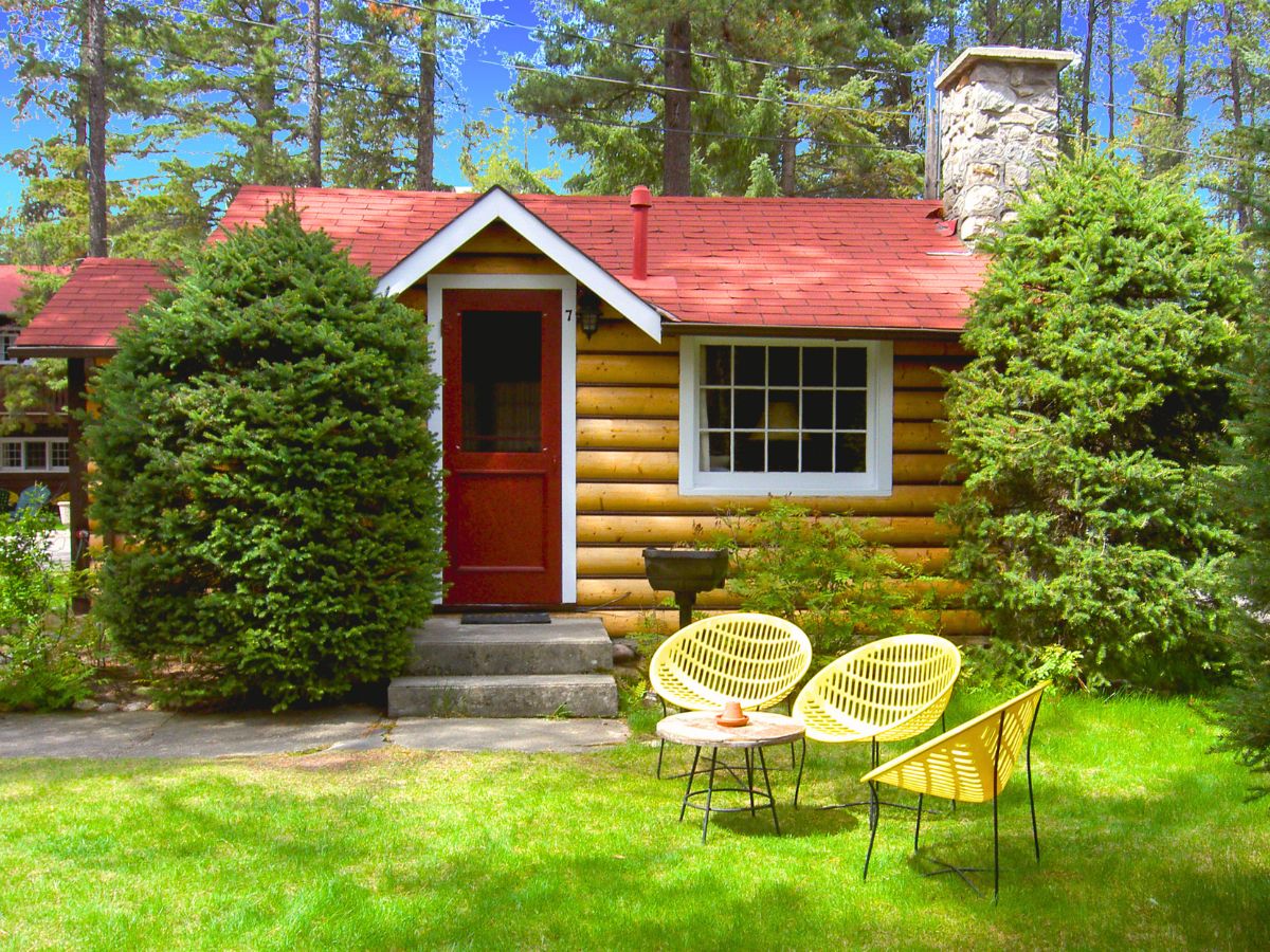 Heritage small one room cabin with fireplace exterior at alpine village jasper