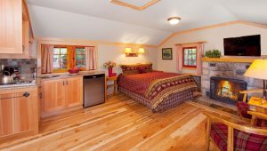 Interior of heritage one room cabin with fireplace