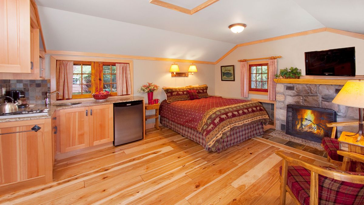Interior of heritage one room cabin with fireplace