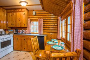 Interior of heritage small one room with 2 twin beds - kitchen area