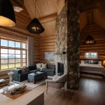 The living area and bed of our Executive One Bedroom Cabin