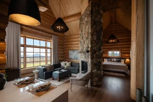 The living area and bed of our Executive One Bedroom Cabin