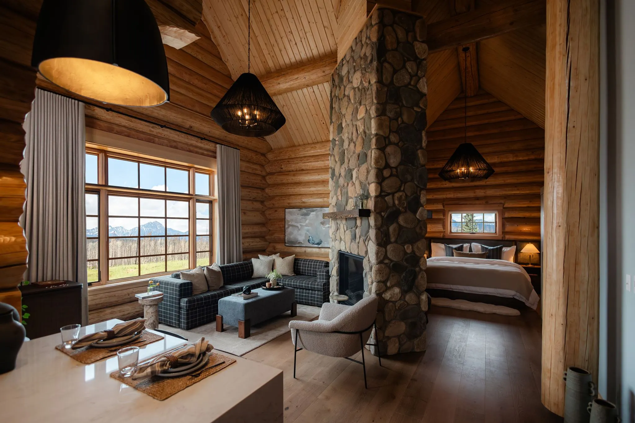 The living area and bed of our Executive One Bedroom Cabin